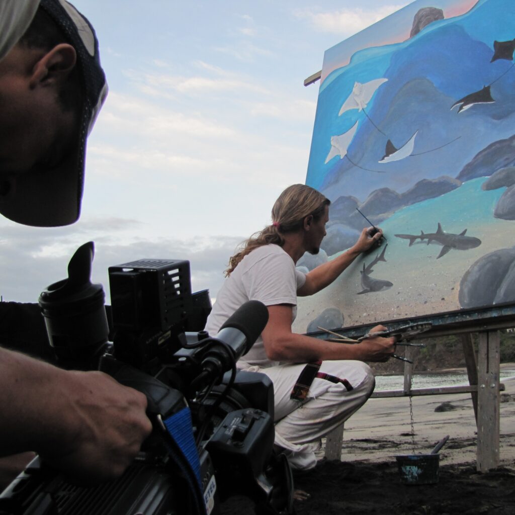 Carlos Hiller marine artist painting for Costarican TV show.